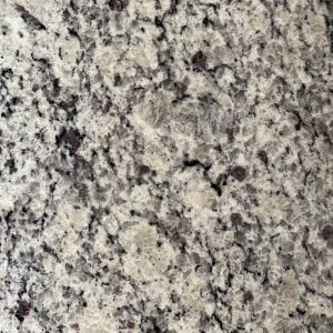 Light gray granite countertop with dark gray and black mineral flecks and subtle veining