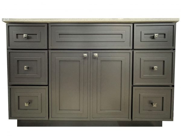Gray bathroom vanity with three horizontal drawers above two center cabinet doors and side drawers with light countertop