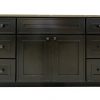 Dark charcoal gray bathroom vanity with six drawers flanking two center cabinet doors and light stone countertop