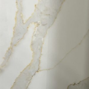 Close-up of white marble countertop with gold and gray veining