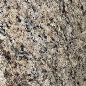 Textured granite surface featuring mixed gray, beige, and black speckled pattern