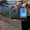 71aX2miYm7L._AC_SL1500_ Person holding portable power station weighing 35 lbs with 12 outlets, measuring 14.56 inches wide and 12.26 inches tall, shown outdoors with nature landscape background