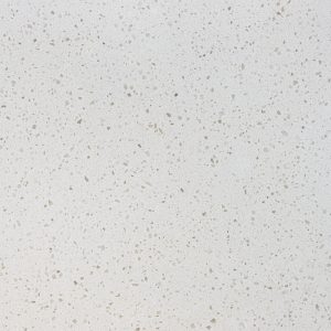 Close-up of white quartz countertop with speckled tan and beige aggregate pattern