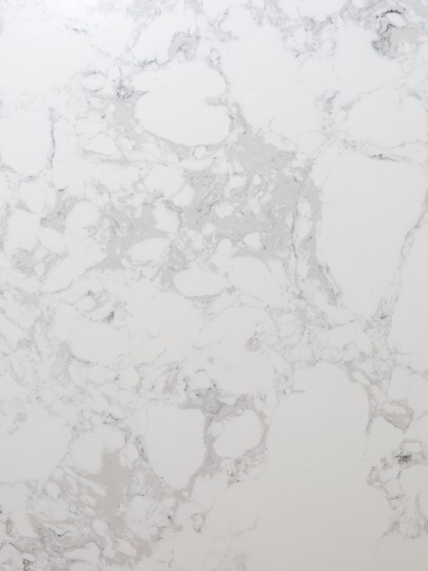 White marble with gray speckles and soft gray veining creating organic patterns