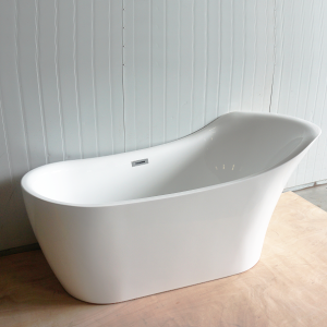 Close-up of white freestanding bathtub with modern curved design, overflow drain, and minimalist architectural style