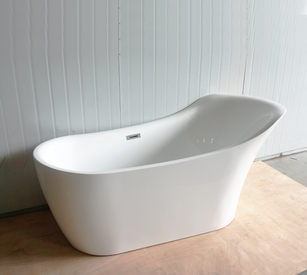 Close-up of white freestanding bathtub with modern curved design, overflow drain, and minimalist architectural style