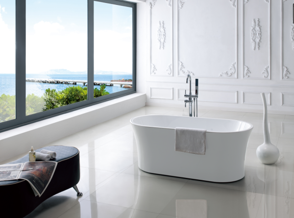 Luxurious modern bathroom with white freestanding oval bathtub, panoramic window overlooking coastal seaport, white ornate wall paneling, and minimalist decor