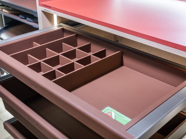 Pink drawer organizer with compartmentalized dividers for jewelry and accessories storage