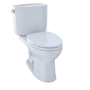 White two-piece toilet with closed lid and tank, viewed from a slight angle