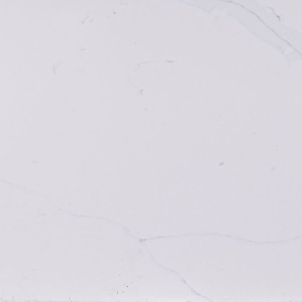 Smooth white marble slab with subtle gray veins and light surface variations