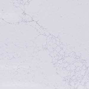 White marble surface with gray veining pattern and textured aggregate finish