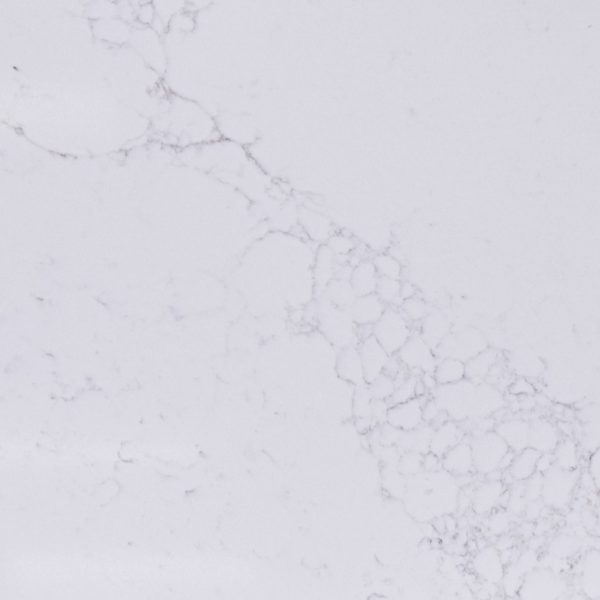 White marble surface with gray veining pattern and textured aggregate finish
