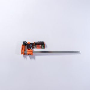 Jorgensen orange pipe clamp with metal bar shown from top view angle