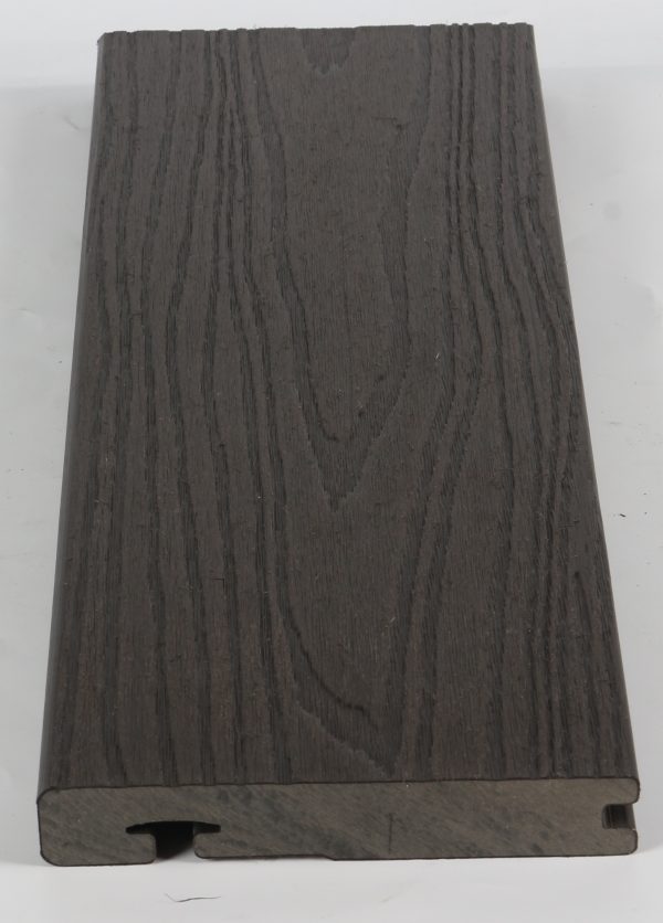 Close-up of dark gray wood grain textured flooring sample with interlocking edge profile