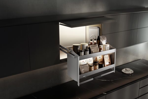 Pull-out kitchen drawer with LED lighting displaying coffee supplies and beverage packets