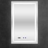 Vertical rectangular LED bathroom mirror with white frame, digital display showing time, and blue control buttons on dark wall