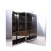 Modern glass-front medicine cabinet with white frame and chrome handles displaying shelves, door open