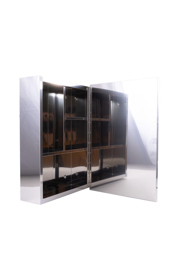 Modern glass-front medicine cabinet with white frame and chrome handles displaying shelves, door open