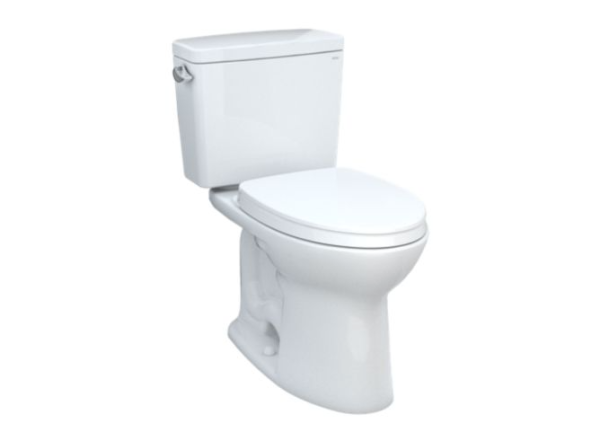 White two-piece toilet with separate tank and bowl, closed lid, viewed from side angle