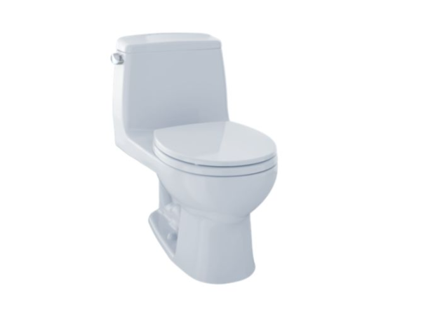 White one-piece toilet with closed lid and tank, viewed from front-angled perspective