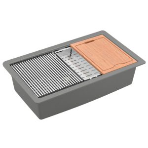 Gray undermount kitchen sink with stainless steel grill rack, colander, and wooden cutting board