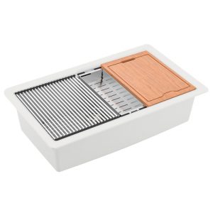 White undermount kitchen sink with grill rack, colander, and bamboo cutting board accessories