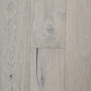 Light bleached oak wood flooring with prominent grain patterns, knots, and visible floor seams