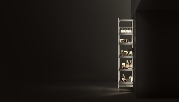 Tall narrow pull-out pantry cabinet with multiple shelves displaying various food products and beverages