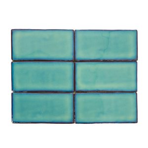 Turquoise blue subway tiles with dark blue grout lines arranged in a 2x3 grid pattern