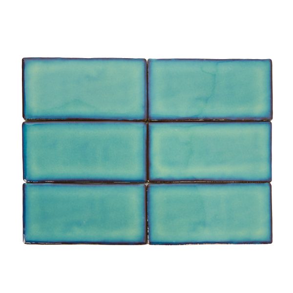 Turquoise blue subway tiles with dark blue grout lines arranged in a 2x3 grid pattern