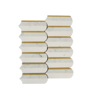 White marble brick tiles with gold brass dividers in elongated hexagonal pattern