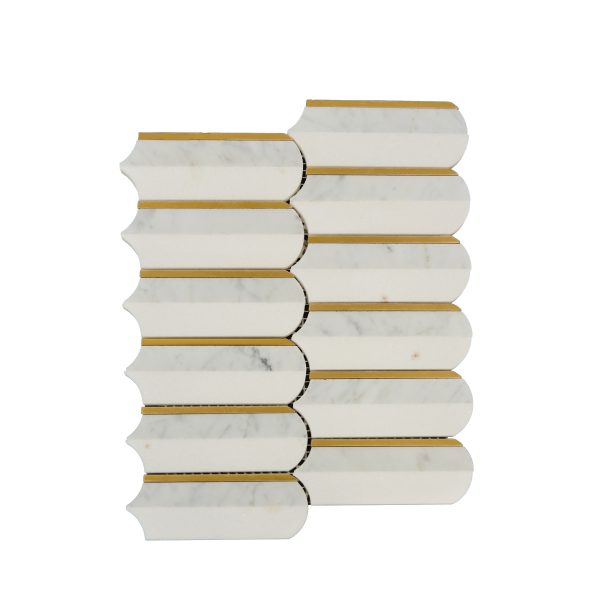 White marble brick tiles with gold brass dividers in elongated hexagonal pattern
