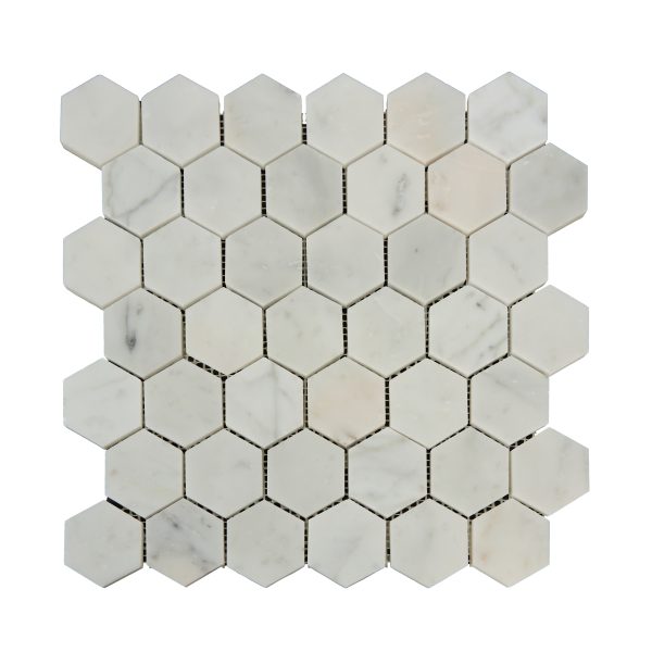 White marble hexagonal mosaic tiles with dark grout lines arranged in honeycomb pattern