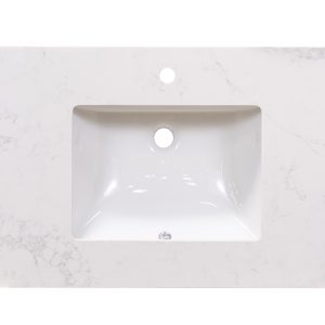 Calacatta marble countertop with centered white rectangular undermount sink and single faucet hole