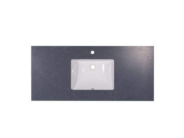 White rectangular undermount sink with single faucet hole installed in dark gray slate countertop, viewed from above