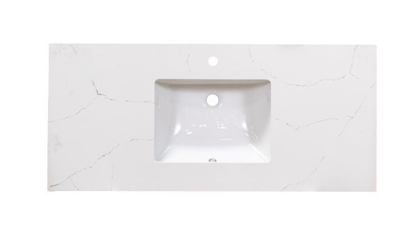 Carrara marble countertop with centered white rectangular sink cutout and single faucet hole