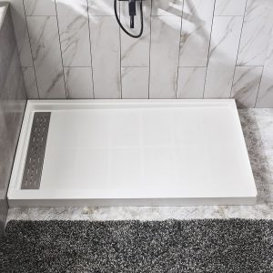 Modern bathroom shower area with marble-look wall tiles and white linear drain pan with dark mat