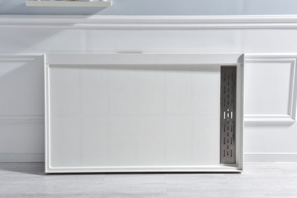 White modern microwave with dark gray vented side panel on gray countertop