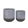 Two gray and black ribbed cylindrical planter pots in different sizes