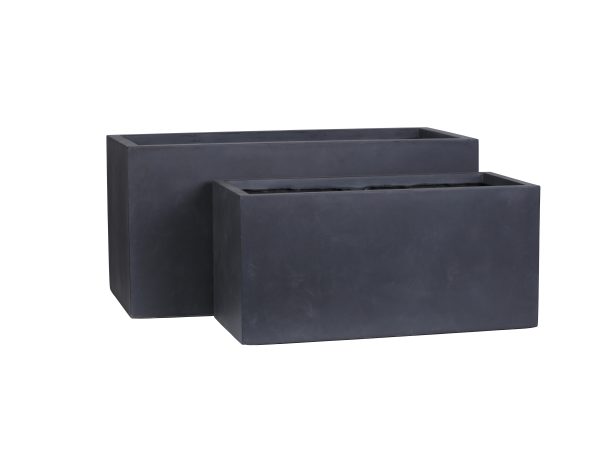 Two dark gray rectangular concrete planters of different sizes arranged together