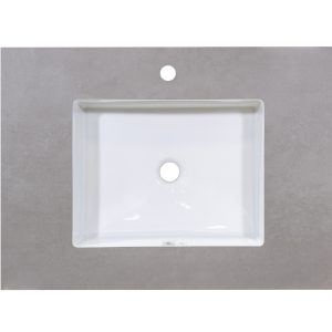 White rectangular bathroom sink with single faucet hole mounted on light gray concrete-look countertop