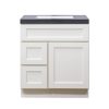 White bathroom vanity cabinet with two drawers and one door, featuring dark gray countertop and built-in sink