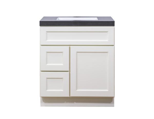 White bathroom vanity cabinet with two drawers and one door, featuring dark gray countertop and built-in sink