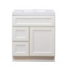White bathroom vanity cabinet with integrated white sink top, two left drawers and one right door