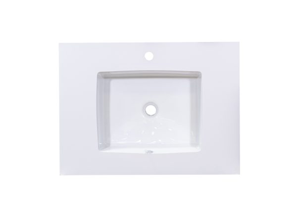 White rectangular bathroom sink with single faucet hole mounted on light gray countertop