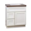 White bathroom vanity with integrated sink, two left drawers and one right cabinet door with brown countertop, angled view