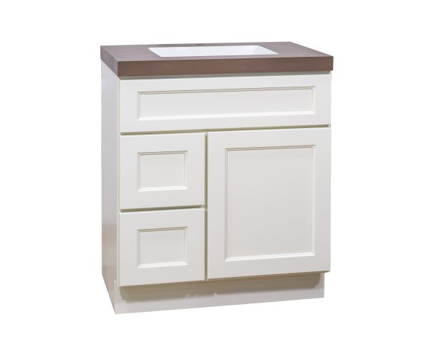 White bathroom vanity with integrated sink, two left drawers and one right cabinet door with brown countertop, angled view