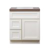 White bathroom vanity cabinet with two drawers and one large door, brown countertop, front view