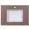 Rectangular white ceramic sink basin with single faucet hole mounted on taupe countertop