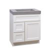 White bathroom vanity cabinet with gray concrete countertop and rectangular sink, showing two center doors and two left side drawers